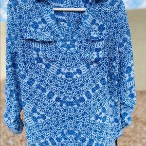 A blue flowy blouse.